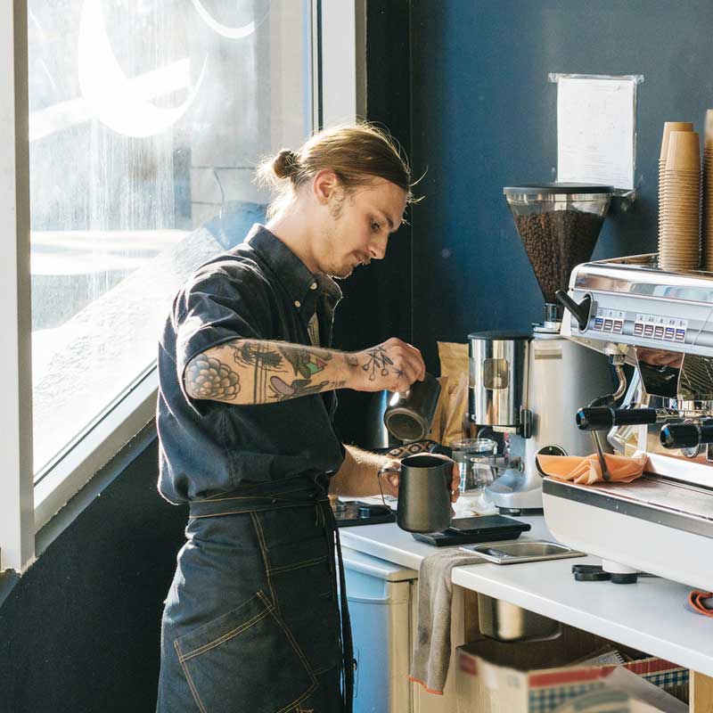 Barista making coffee