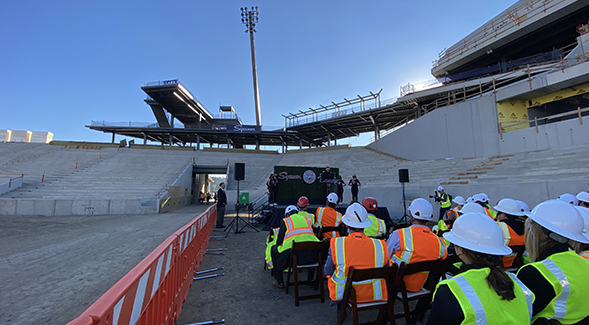 Spectators attend an announcement at the Aztec Stadium construction site.